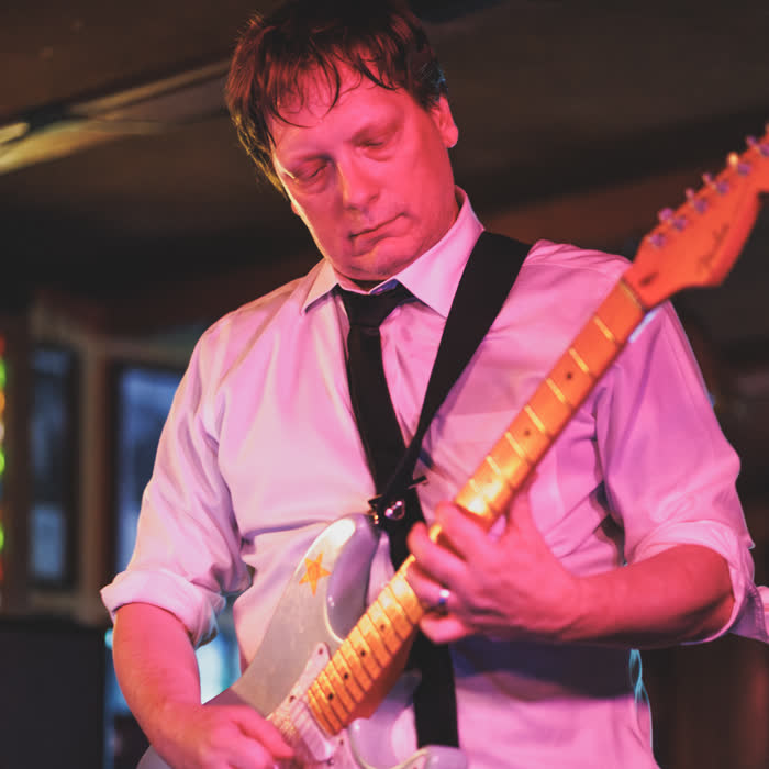 TJ Wark playing his silver Stratocaster